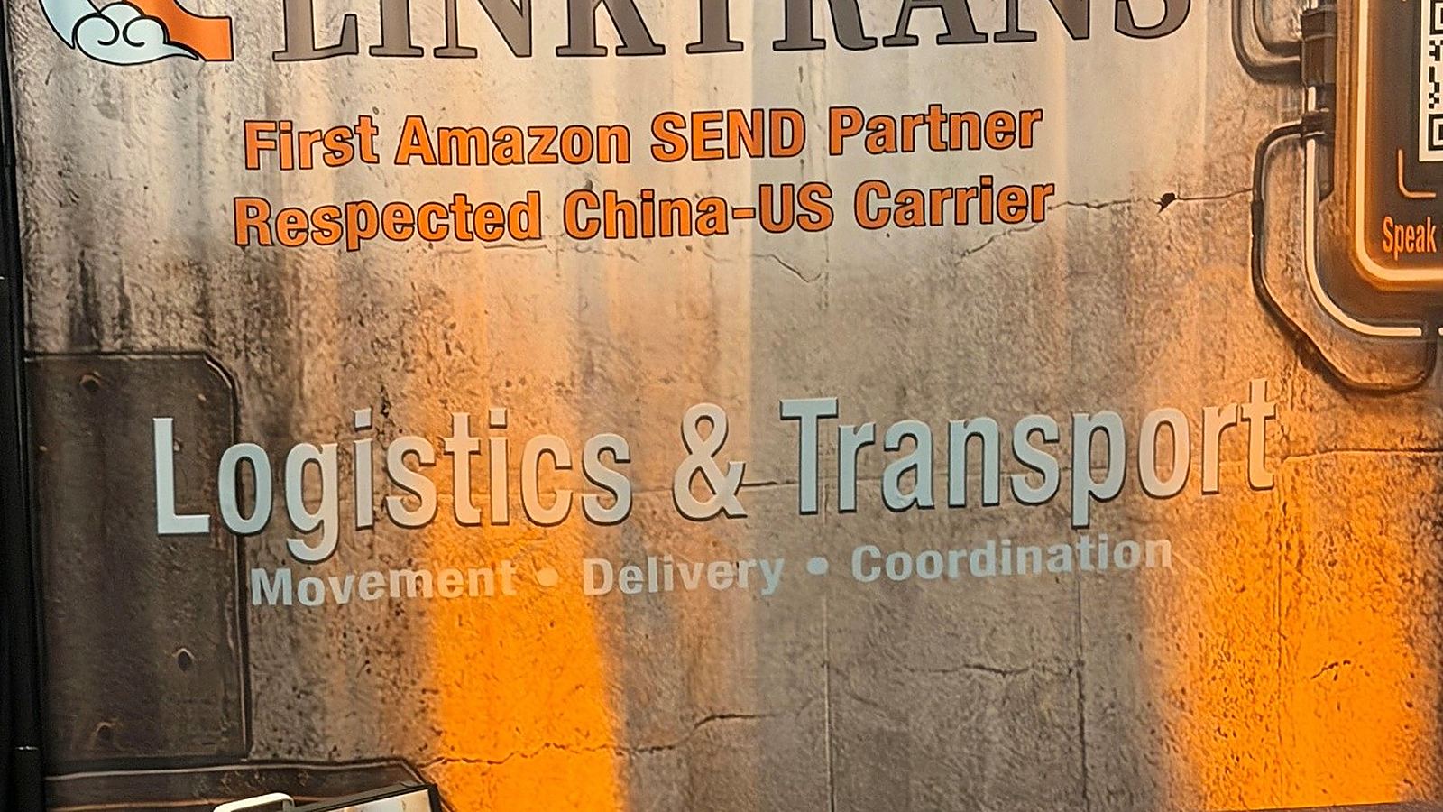 LinkTrans branded booth backdrop at the Nashville summit